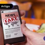Uma imagem que ilustra uma pessoa utilizando o celular e descobrindo como identificar notícias falsas.
