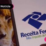 Imagem de um leão ao lado de um celular com logo da receita federal