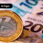 Imagem de uma moeda de um real e cédulas de cem e duzentos reais