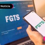 Computador e celular com site e aplicativo do FGTS na tela.