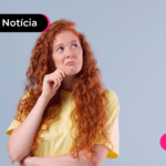 Jovem pensando em sacar FGTS que virá com o décimo terceiro salário.
