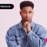 Jovem com expressão de dúvida pensando sobre como vai funcionar a multa rescisória no empréstimo consignado.