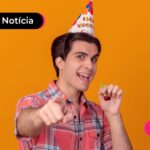 Aniversariante sorrindo após ler notícia sobre saque aniversário do FGTS em fevereiro.