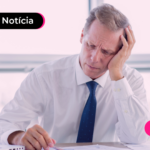 Homem de terno com expressão cabisbaixa.