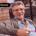 Aposentado fazendo joinha após ler notícia sobre aumento da margem INSS.