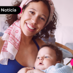 Mulher feliz com pagamento do Bolsa Família para beneficiários com NIS final 5.