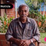 Pessoa de idade com expressão pensativa após ler notícia sobre confirmação indivudal do Consignado INSS.