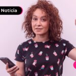Mulher usando celular para ler notícia sobre garantia do Consignado CLT.