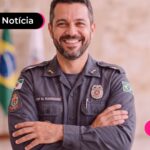 Policial feliz com isenção do imposto de renda.