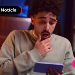 Pessoa jovem surpresa com bloqueio de beneficiários do Bolsa Família e FIES em bets e sites de aposta.