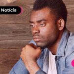 Homem pensando por que o Brasil não consegue aumentar o salário para o valor necessário.