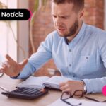 Trabalhador calculando previsão do aumento do salário mínimo de 2027.