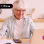 Idosa feliz com aumento de margem do empréstimo consignado INSS.