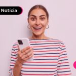 Mulher feliz com notícia de Banco Central estuda integrar pix