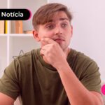 Homem de camiseta verde fazendo uma expressão de pensativo.